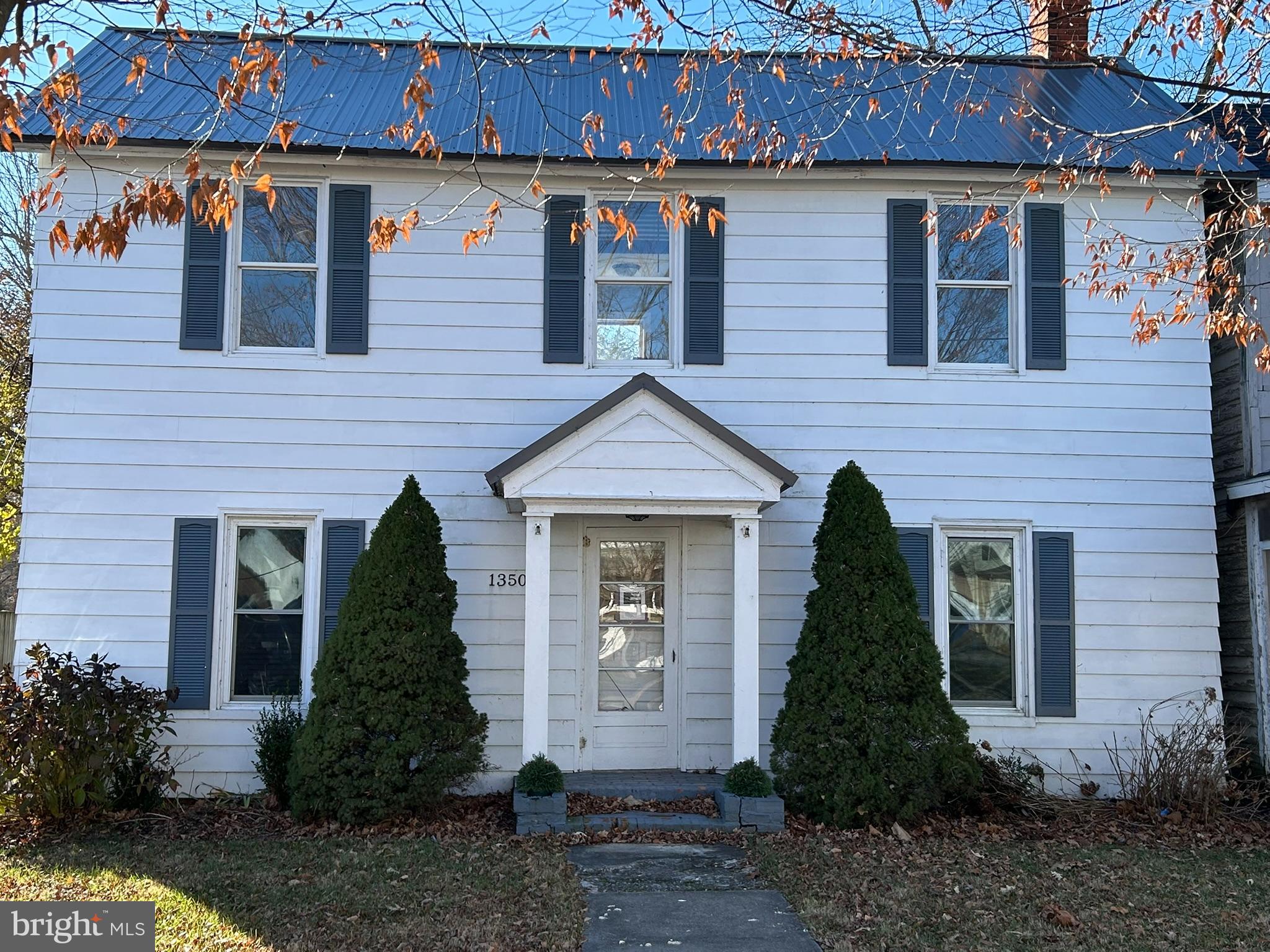 13508 Main Street Queen Anne, MD 21657 - Photo 1 of 22 a front view of a house with a yard and trees