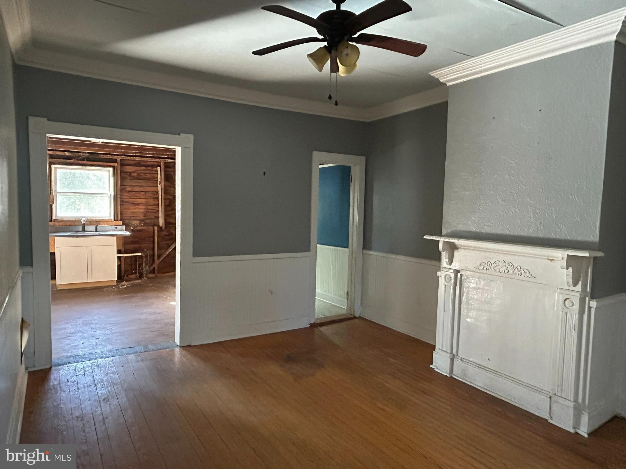 13508 Main Street Queen Anne, MD 21657 - Photo 8 of 22 an empty room with wooden floor and windows