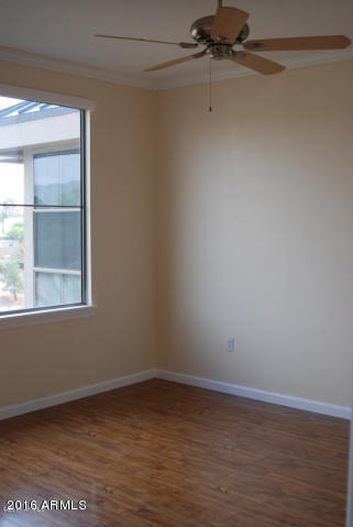 1701 East Colter Street, Unit 333 Phoenix, AZ 85016 - Photo 15 of 36 an empty room with a window