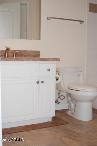 1701 East Colter Street, Unit 333 Phoenix, AZ 85016 - Photo 16 of 36 a bathroom with a sink and a toilet