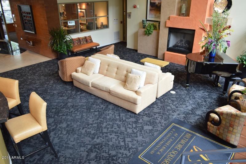 1701 East Colter Street, Unit 333 Phoenix, AZ 85016 - Photo 23 of 36 a living room with furniture and a fireplace