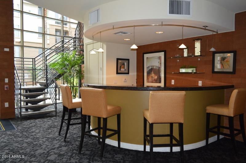 1701 East Colter Street, Unit 333 Phoenix, AZ 85016 - Photo 24 of 36 a view of a dining room with furniture and window