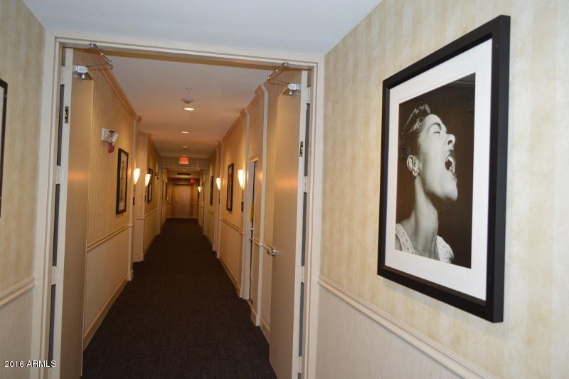 1701 East Colter Street, Unit 333 Phoenix, AZ 85016 - Photo 25 of 36 a hallway with wooden floor and a hallway