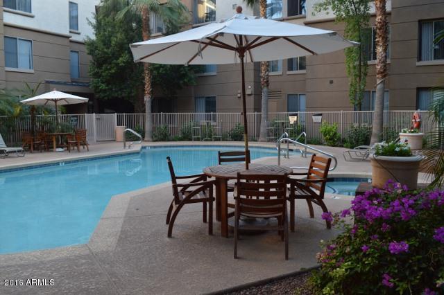 1701 East Colter Street, Unit 333 Phoenix, AZ 85016 - Photo 33 of 36 a view of a backyard with sitting area and furniture