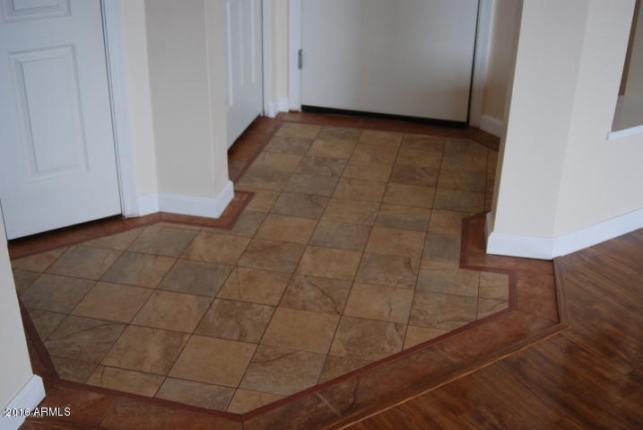1701 East Colter Street, Unit 333 Phoenix, AZ 85016 - Photo 6 of 36 a view of a room with wooden floor and cabinet