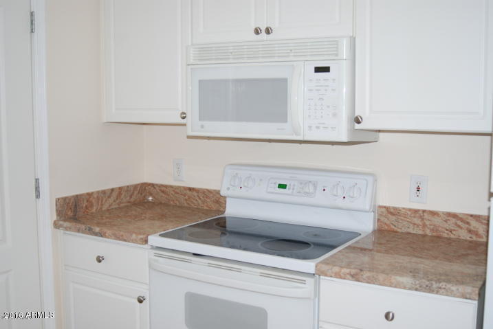 1701 East Colter Street, Unit 333 Phoenix, AZ 85016 - Photo 8 of 36 a utility room with a sink dishwasher stove and white cabinets