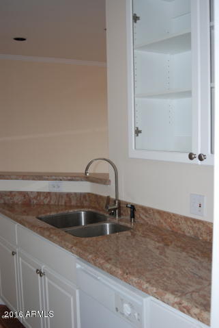 1701 East Colter Street, Unit 333 Phoenix, AZ 85016 - Photo 9 of 36 a kitchen with a sink and cabinets