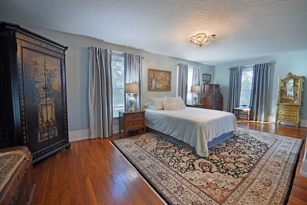 63 Loving Road Morganton, GA 30560 - Photo 33 of 58 a bedroom with a large bed and a dresser