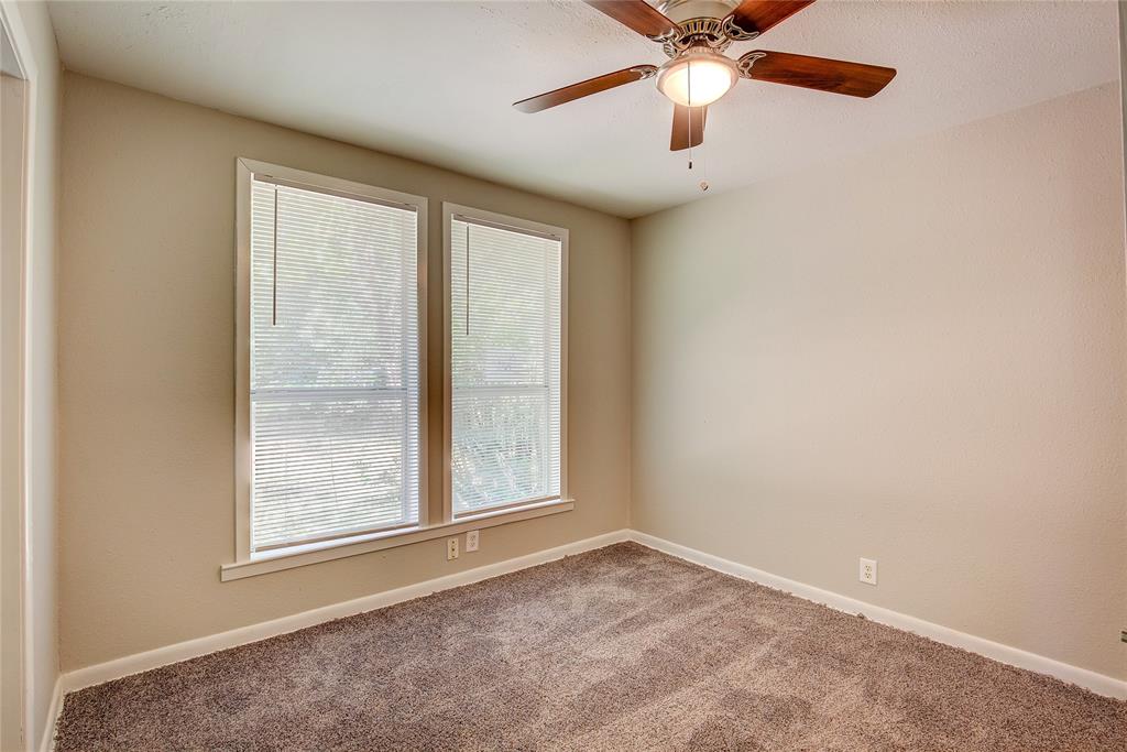 620 Harrison Lane Hurst, TX 76053 - Photo 25 of 32 an empty room with windows and fan