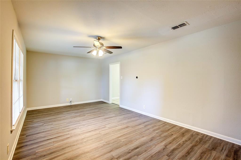 620 Harrison Lane Hurst, TX 76053 - Photo 6 of 32 a view of an empty room with wooden floor