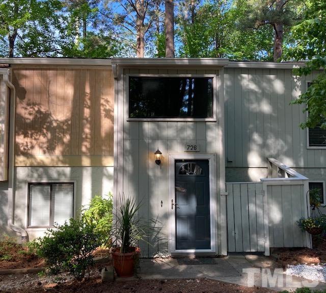 a picture of a building with a yard