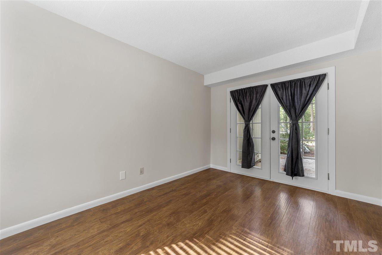 726 Godwin Court Raleigh, NC 27606 - Photo 14 of 23 a view of a room with wooden floor and a window