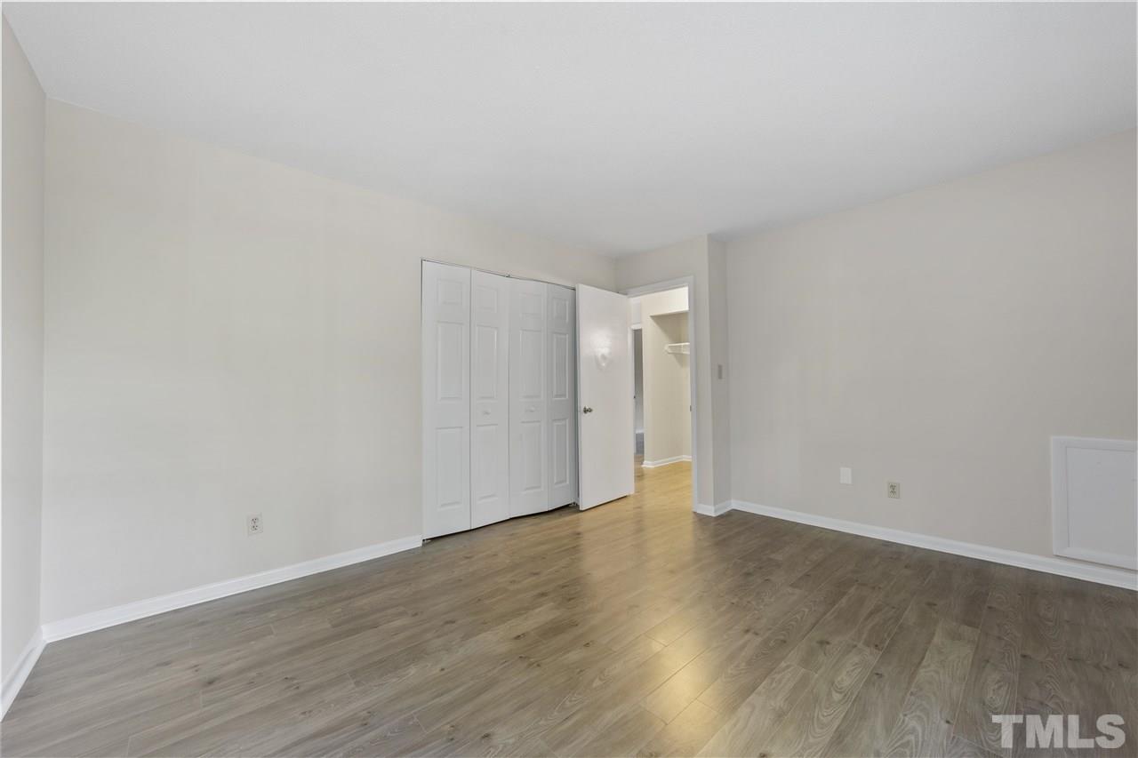 726 Godwin Court Raleigh, NC 27606 - Photo 17 of 23 a view of an empty room with wooden floor