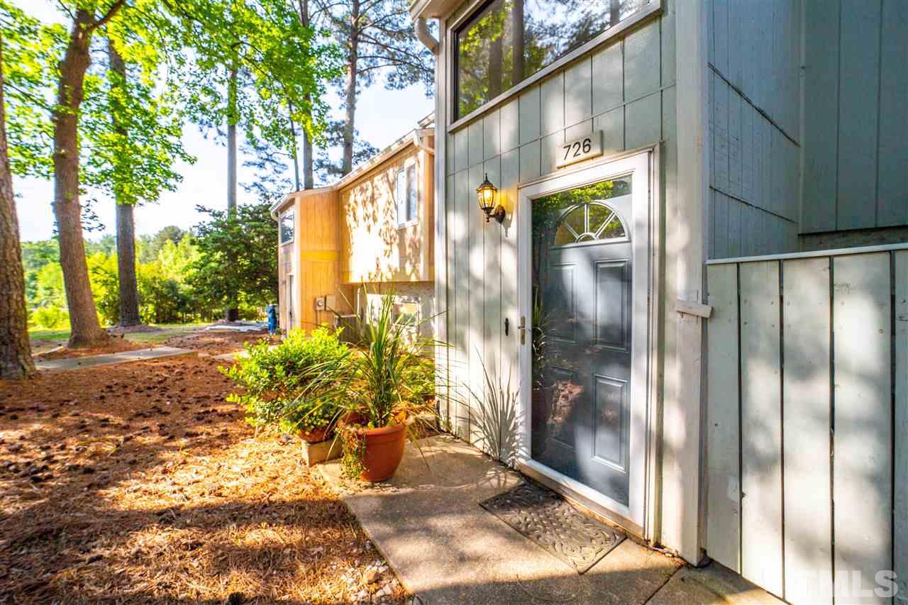 726 Godwin Court Raleigh, NC 27606 - Photo 4 of 23 a view of a back yard from a building from a glass door