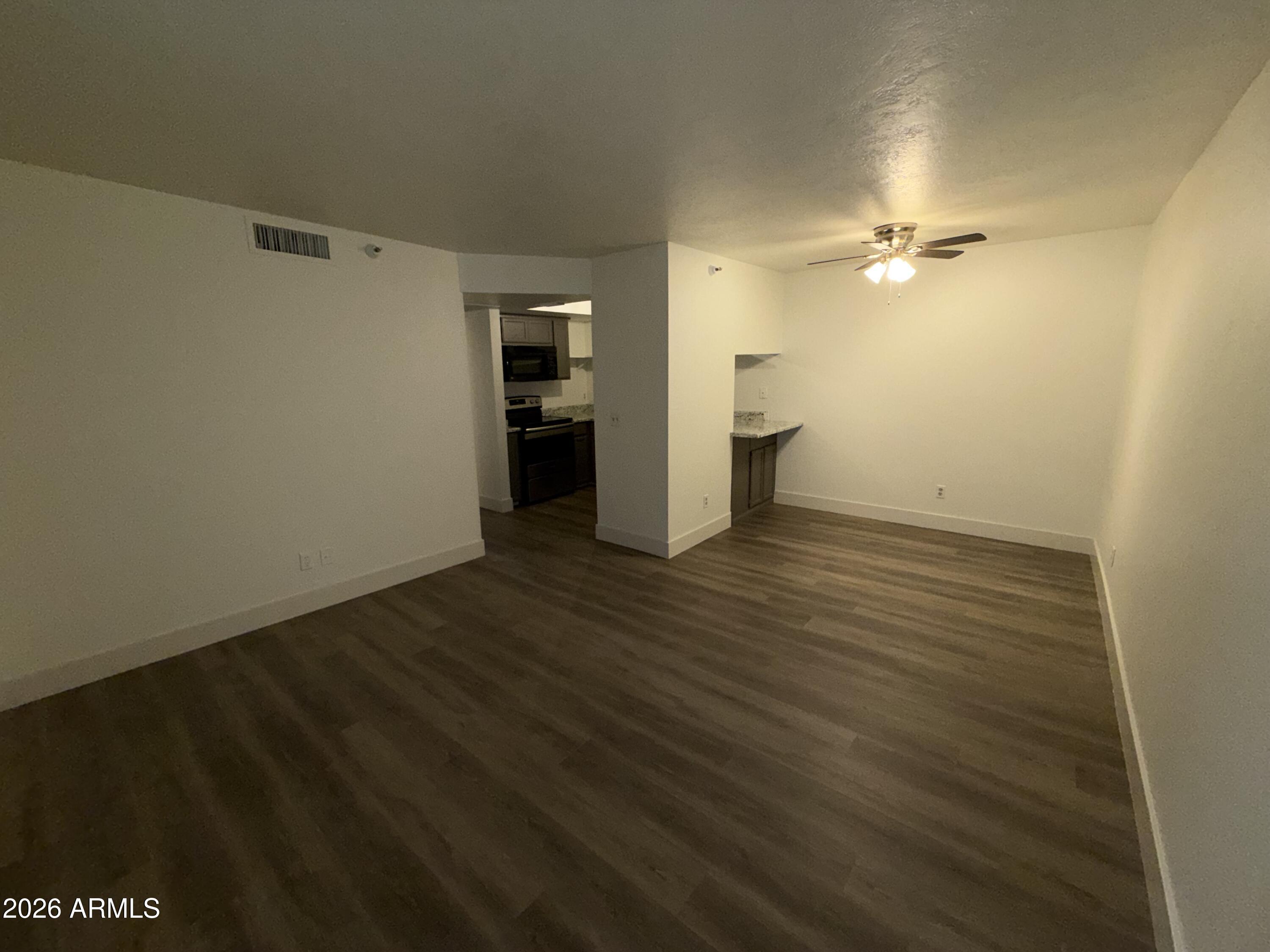 17 East Ruth Avenue, Unit 305 Phoenix, AZ 85020 - Photo 2 of 12 wooden floor in an empty room