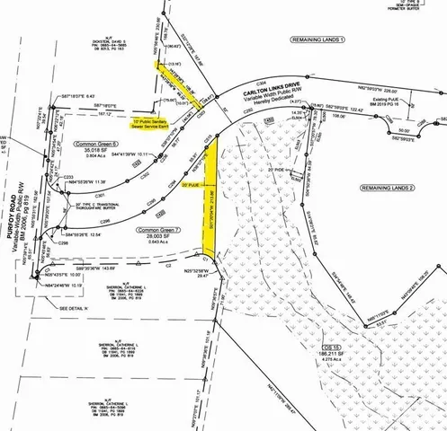 a view of a lake with a yard