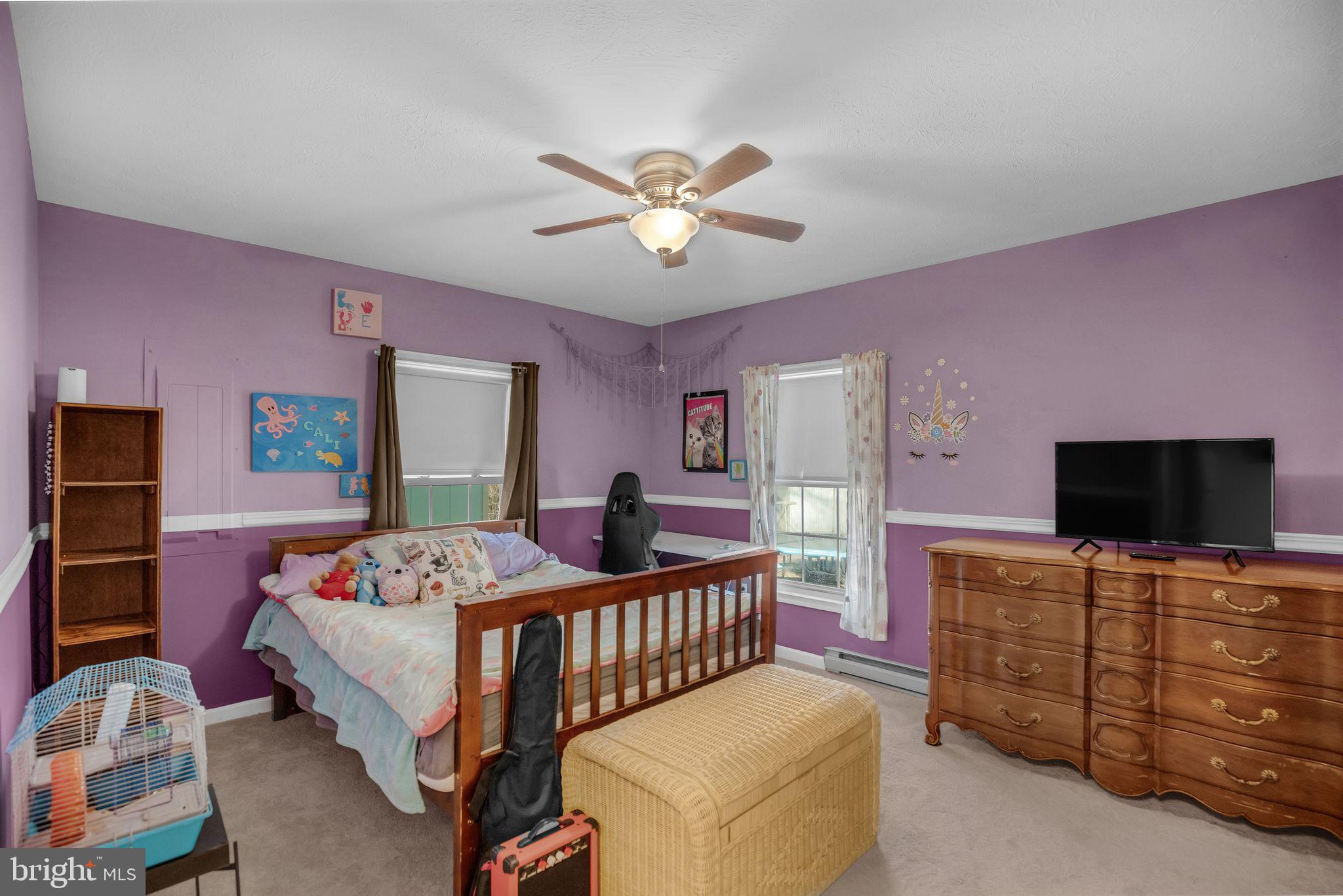 48550 Havirland Road Lexington Park, MD 20653 - Photo 15 of 36 a bedroom with a bed and a flat screen tv