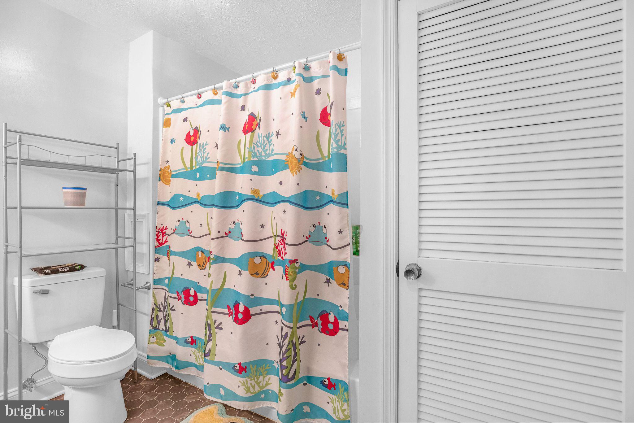 48550 Havirland Road Lexington Park, MD 20653 - Photo 18 of 36 a bathroom with a sink toilet and curtain