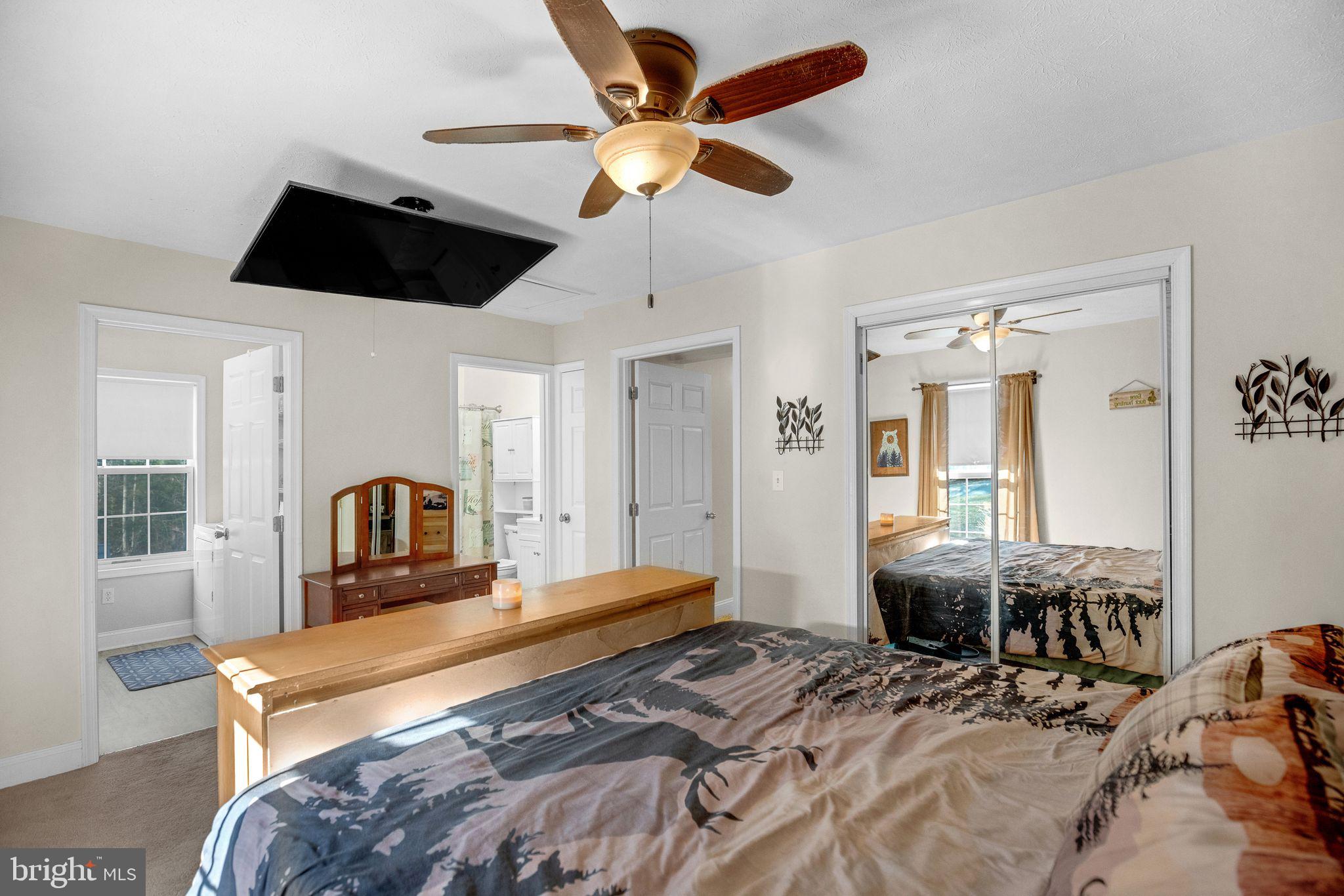 48550 Havirland Road Lexington Park, MD 20653 - Photo 20 of 36 a bedroom with furniture and a flat screen tv