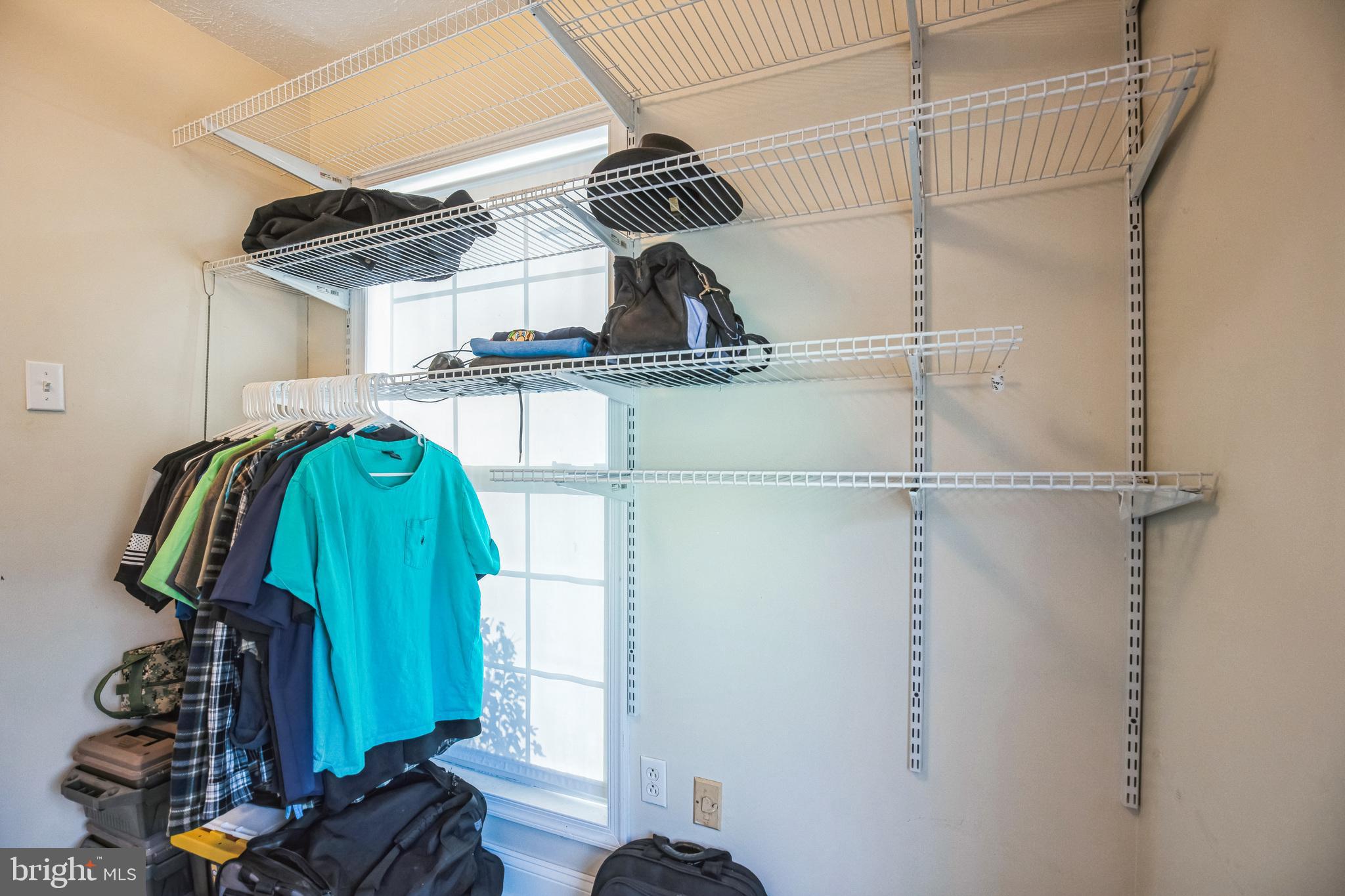 48550 Havirland Road Lexington Park, MD 20653 - Photo 23 of 36 a view of walk in closet with clothes and shoes