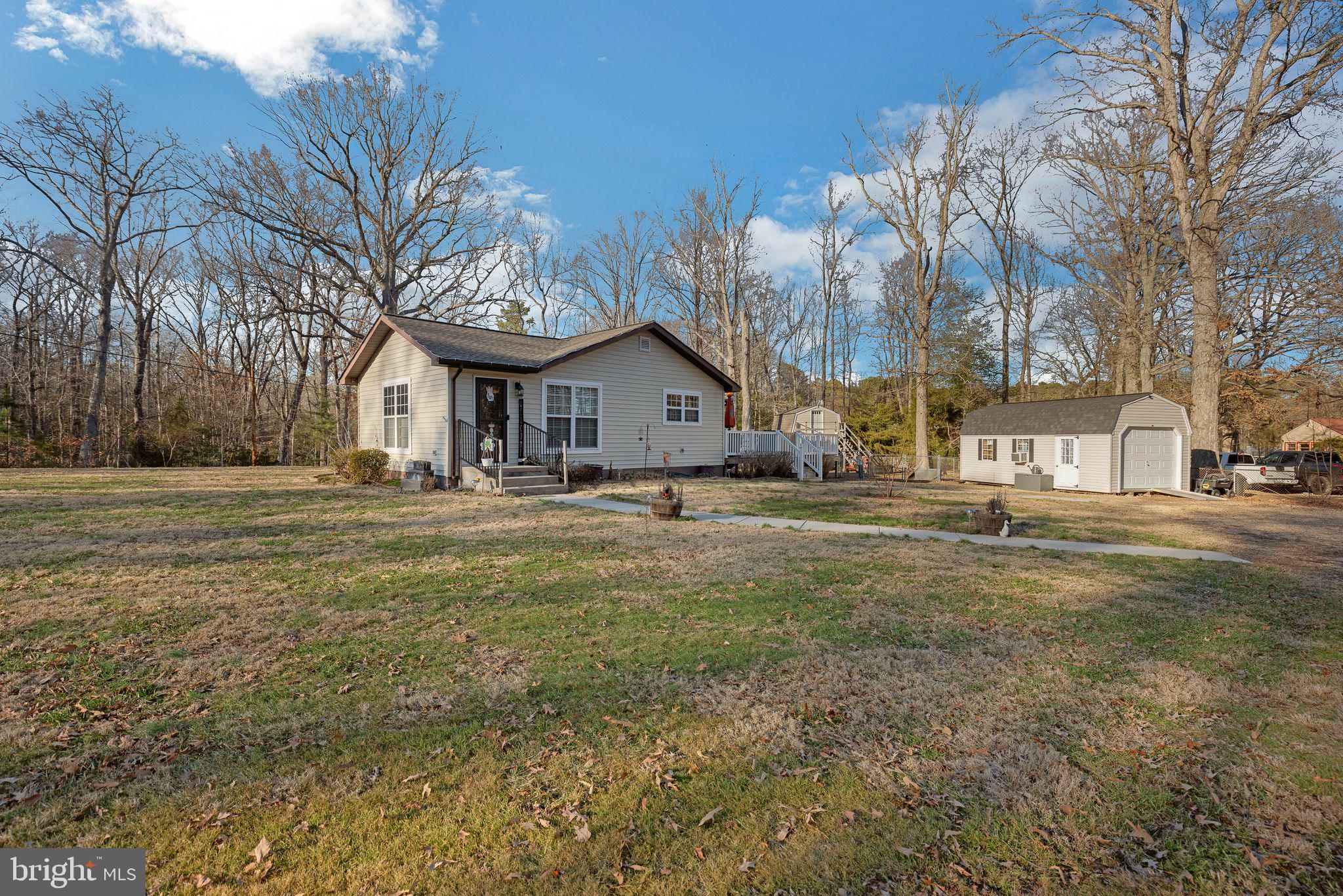 48550 Havirland Road Lexington Park, MD 20653 - Photo 3 of 36 a front view of a house with a yard