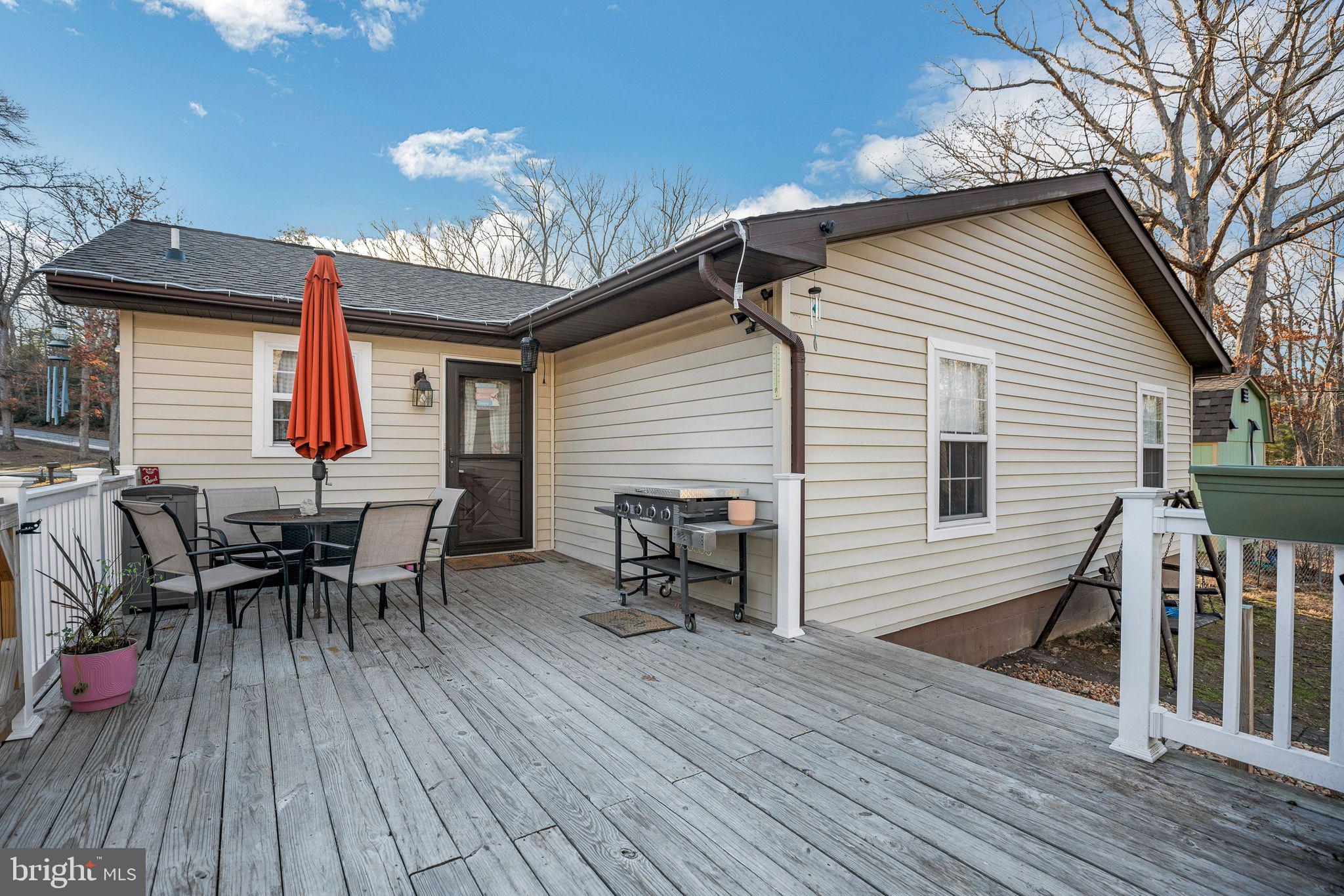 48550 Havirland Road Lexington Park, MD 20653 - Photo 7 of 36 a view of a house with a deck and furniture