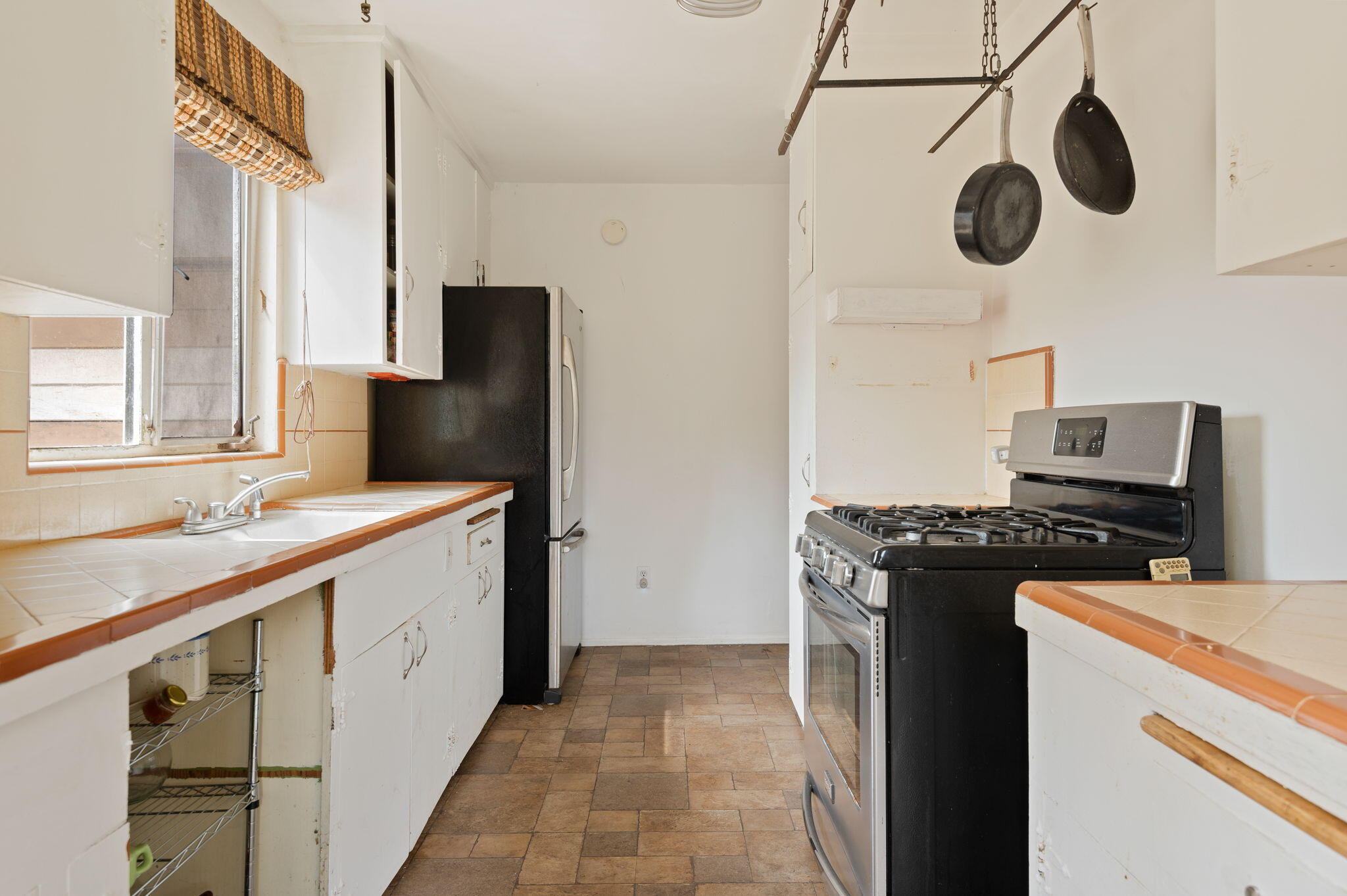 675 Northview Road Santa Barbara, CA 93105 - Photo 5 of 12 a kitchen with a stove and a refrigerator