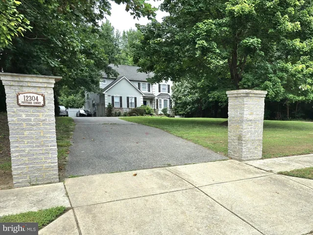 a kitchen with a sink cabinets and stainless steel appliances