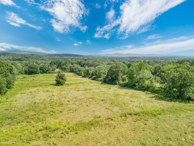 a view of a yard with an ocean view