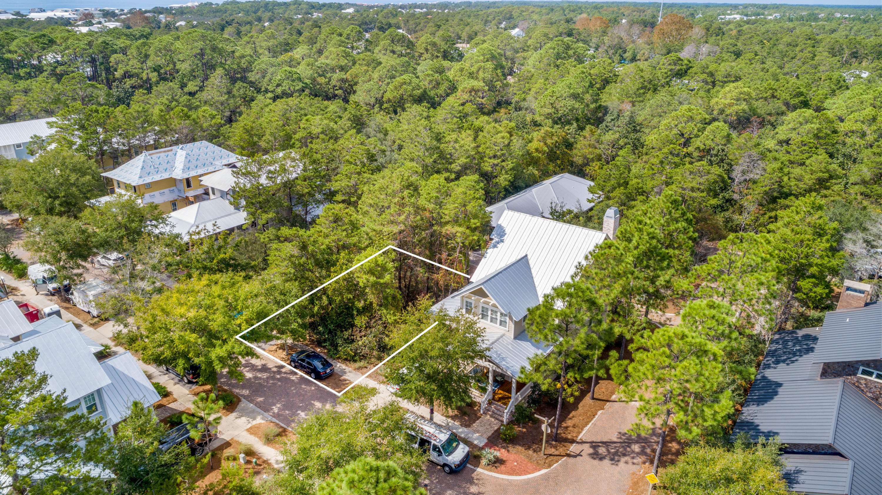 an aerial view of a house with a yard and outdoor seating