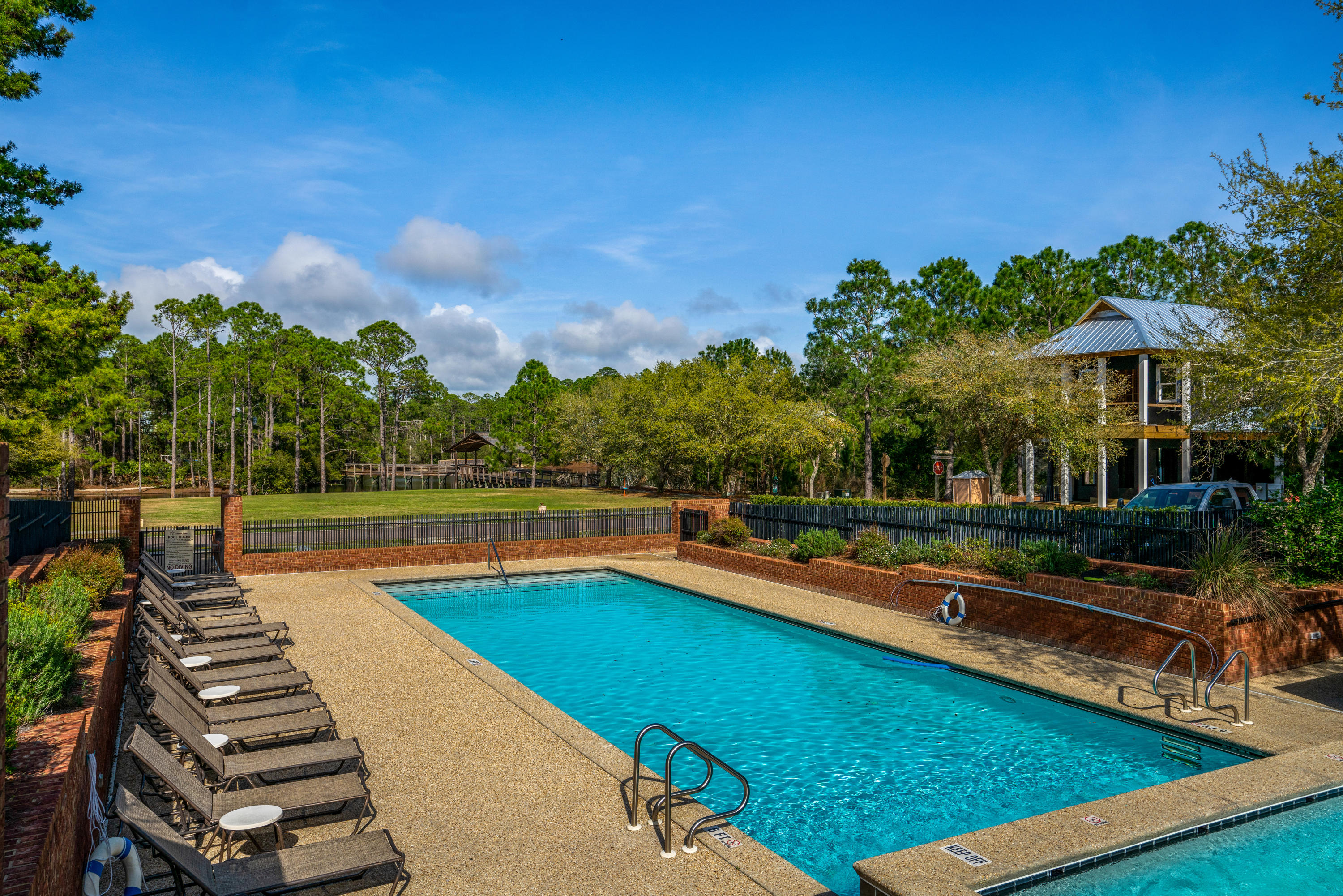 Lot 21 West Okeechobee Santa Rosa Beach Santa Rosa Beach, FL 32459 - Photo 11 of 37 a view of a swimming pool with lounge chairs in patio