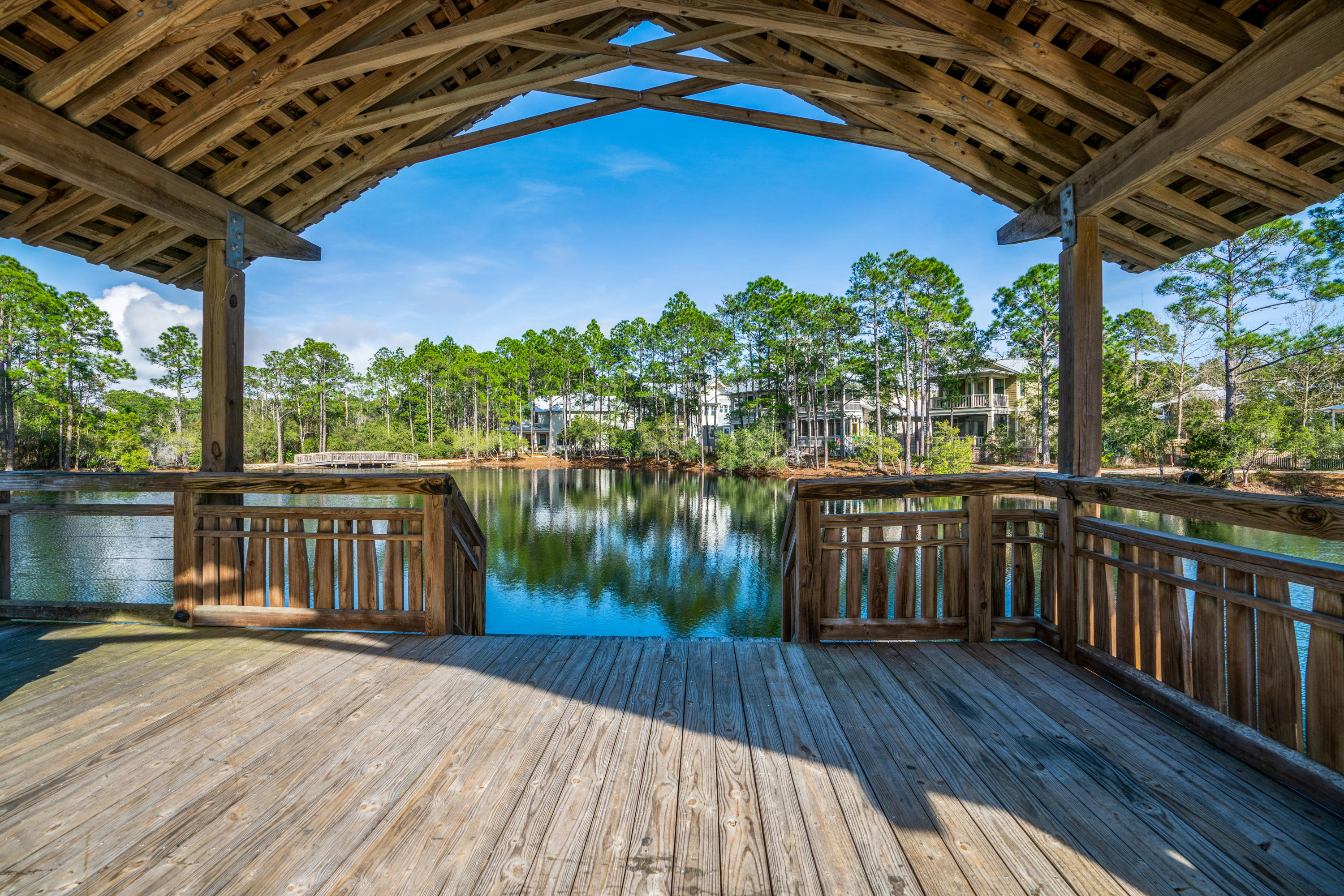 Lot 21 West Okeechobee Santa Rosa Beach Santa Rosa Beach, FL 32459 - Photo 17 of 37 a view of a balcony with lake view and wooden floor