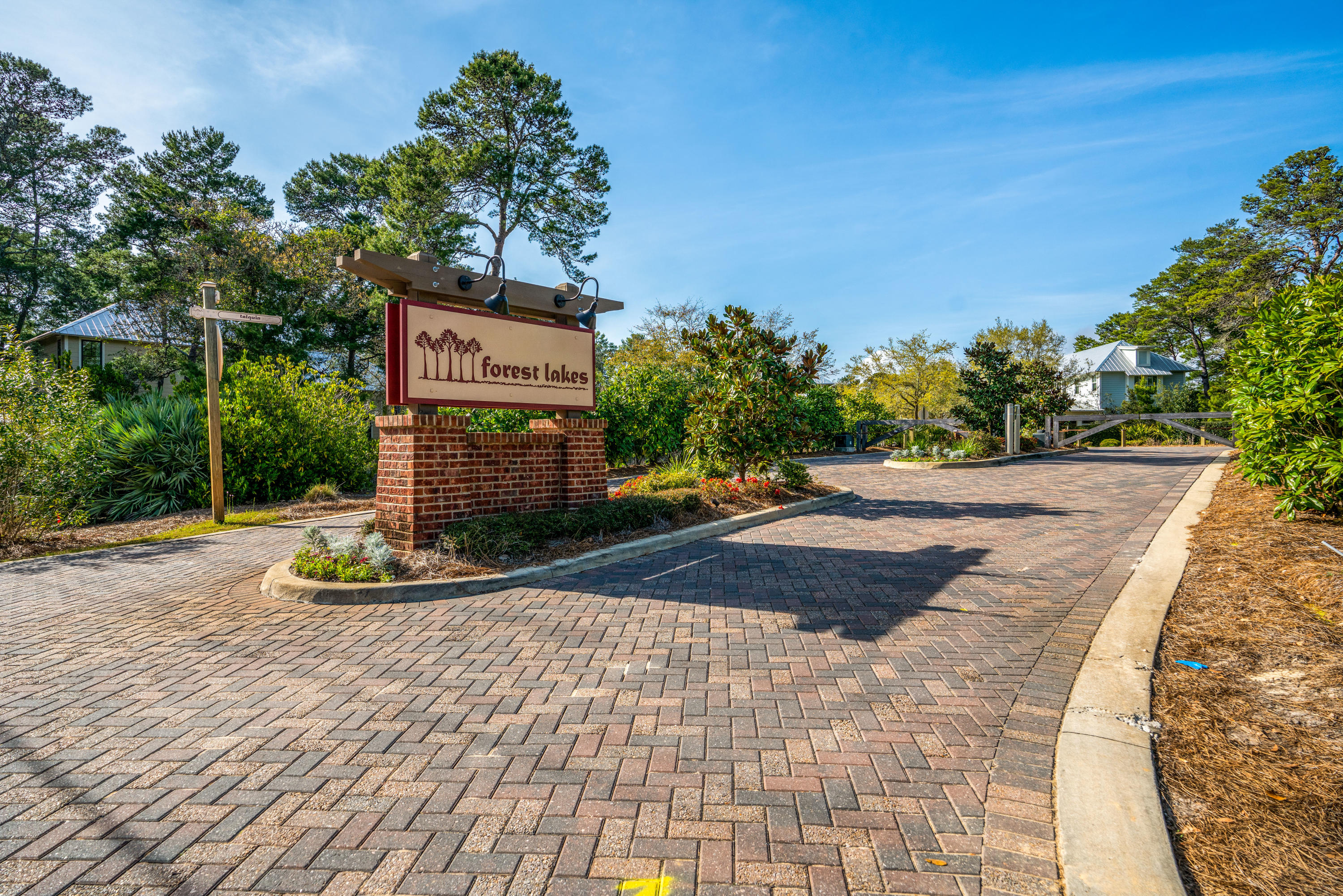Lot 21 West Okeechobee Santa Rosa Beach Santa Rosa Beach, FL 32459 - Photo 21 of 37 a sign board with buildings in the background