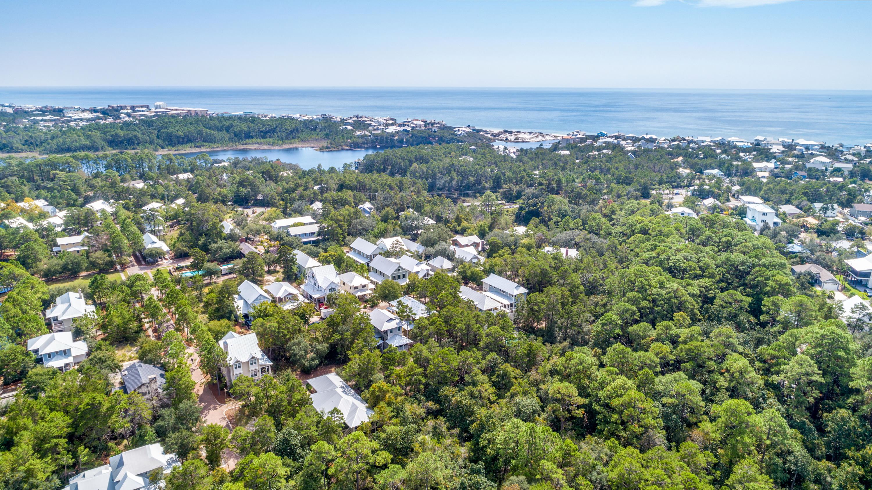 Lot 21 West Okeechobee Santa Rosa Beach Santa Rosa Beach, FL 32459 - Photo 32 of 37 an aerial view of a city with lots of residential buildings and mountain view in back