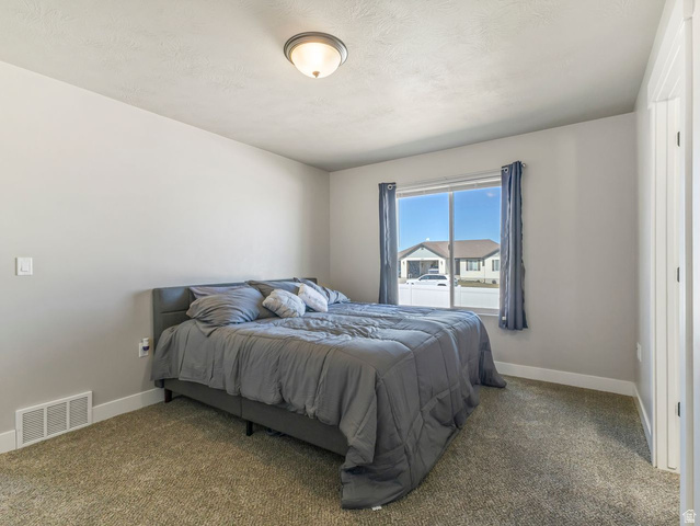573 South Maxwell Drive Grantsville, UT 84029 - Photo 11 of 25 Bedroom with baseboards and carpet floors