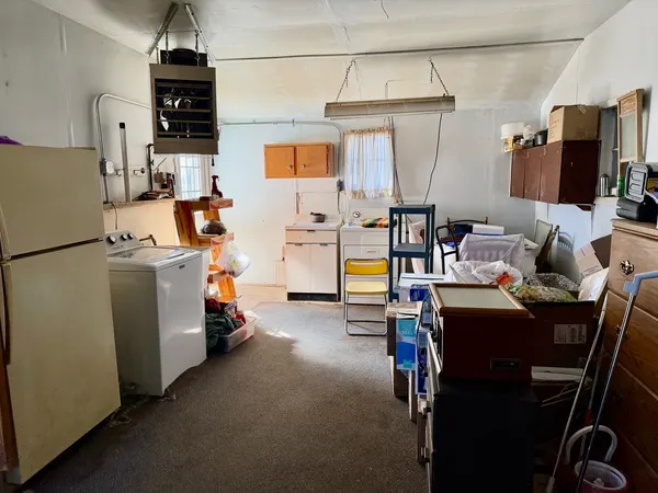 a view of a workspace with furniture and storage