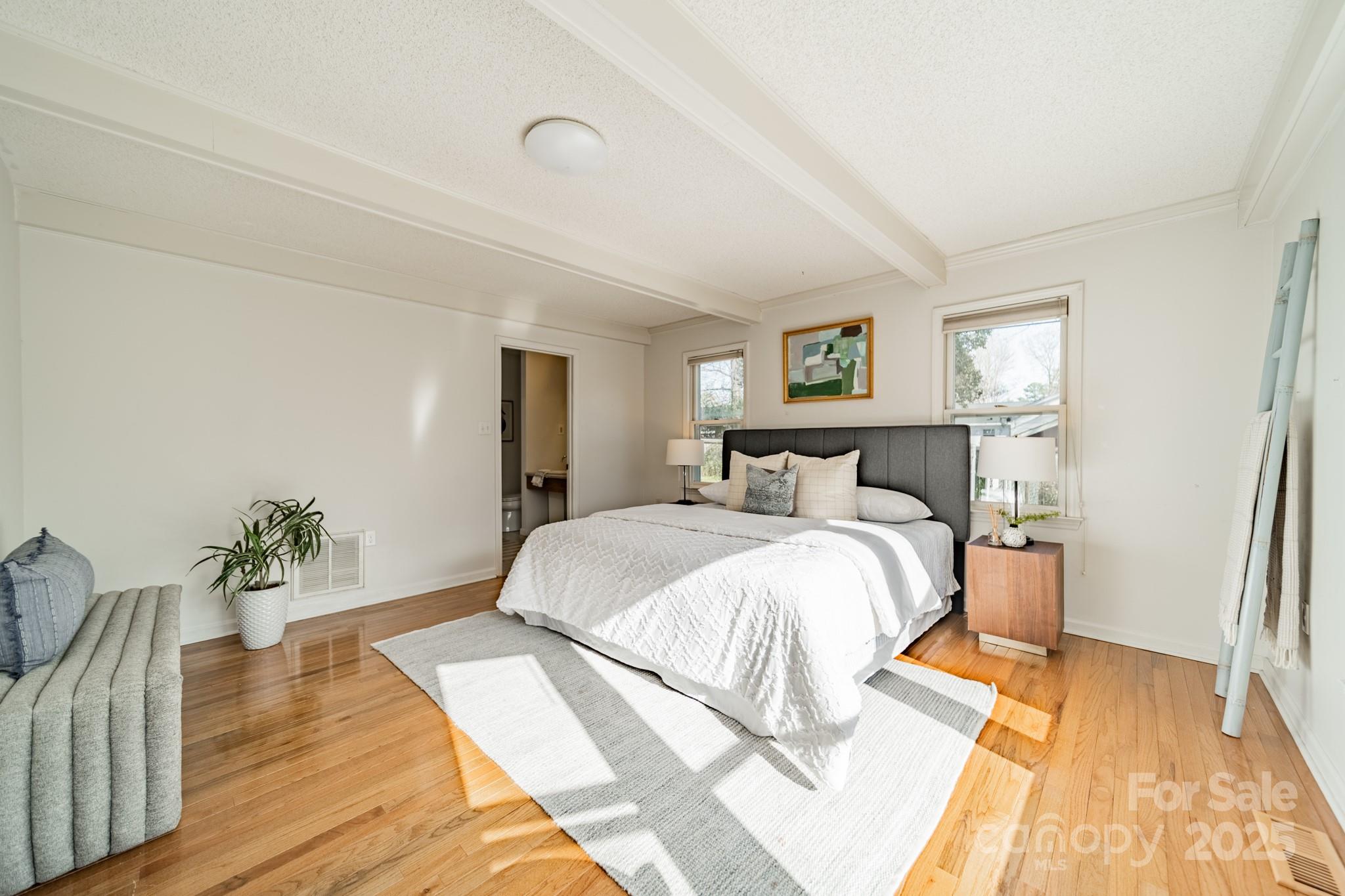 1300 Rama Road Charlotte, NC 28211 - Photo 11 of 30 a spacious bedroom with a bed and wooden floor