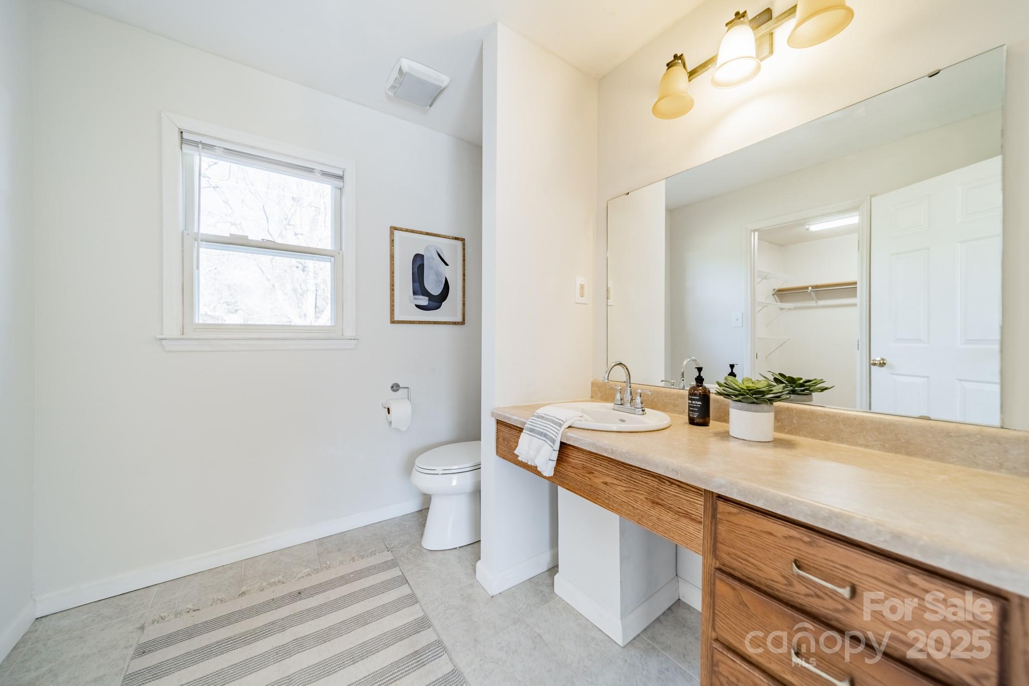 1300 Rama Road Charlotte, NC 28211 - Photo 13 of 30 a bathroom with a granite countertop sink mirror vanity and toilet