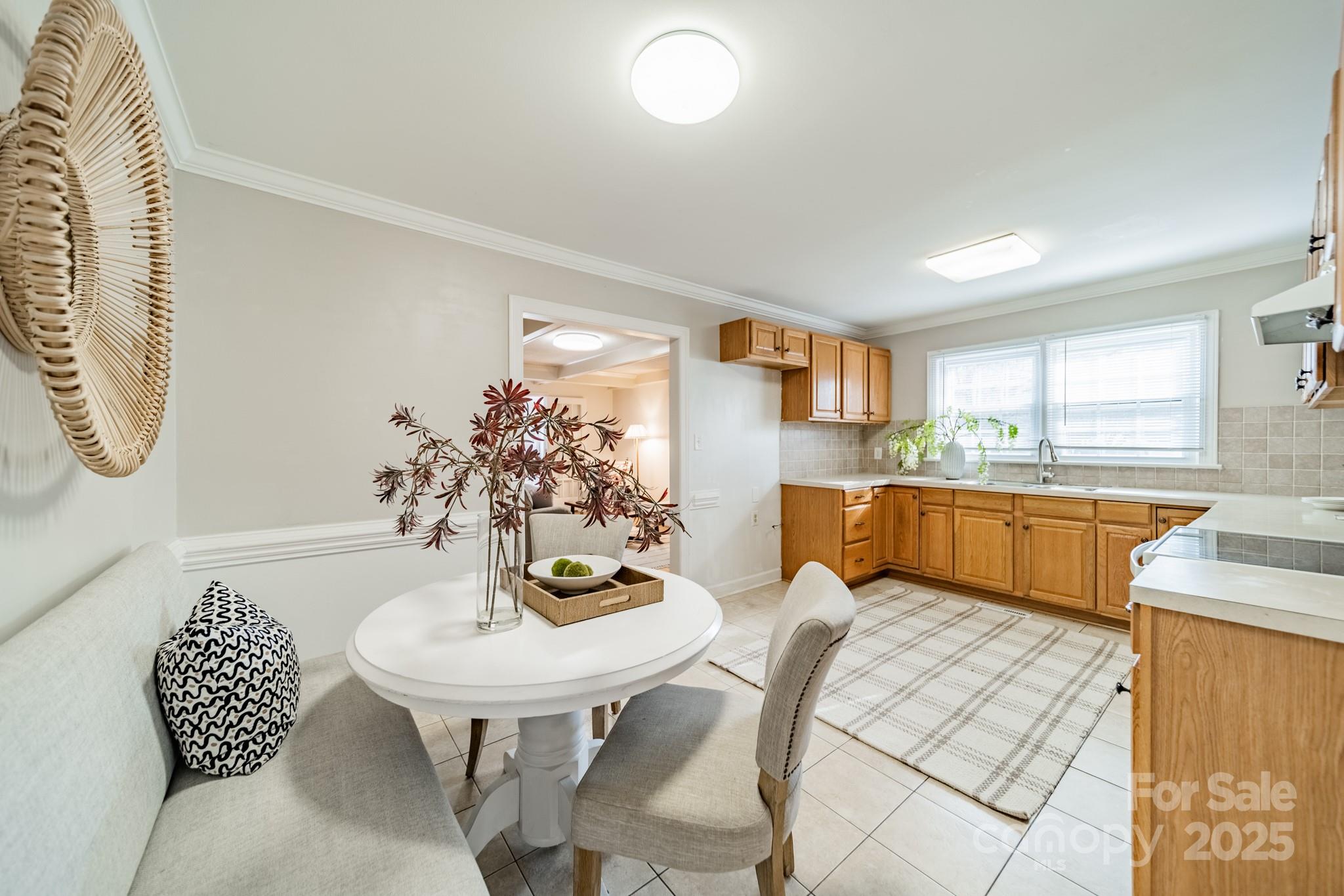 1300 Rama Road Charlotte, NC 28211 - Photo 6 of 30 a kitchen with stainless steel appliances kitchen island granite countertop a table and chairs