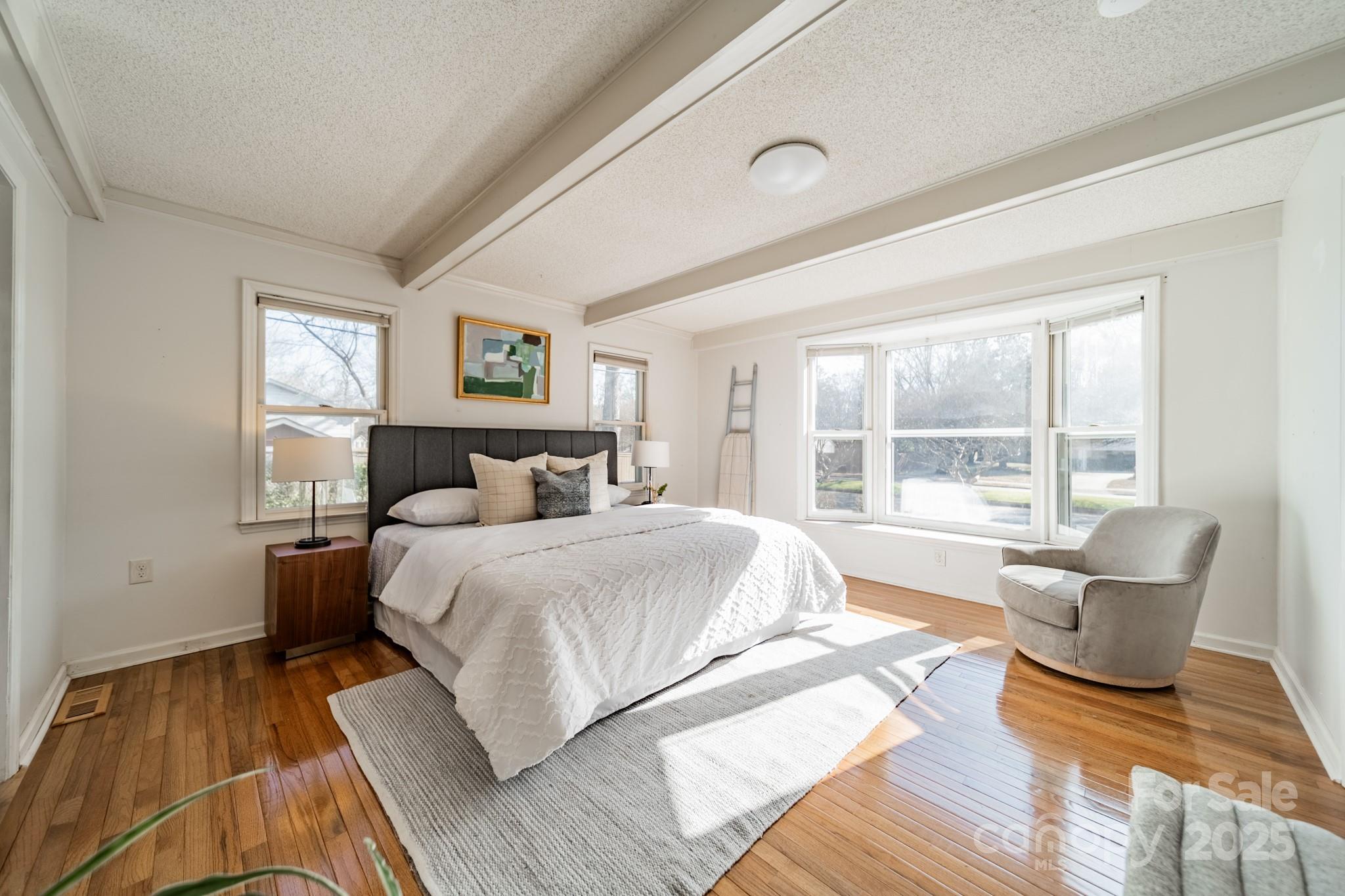 1300 Rama Road Charlotte, NC 28211 - Photo 10 of 30 a spacious bedroom with a bed and glass windows