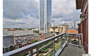 435 South Tryon Street, Unit 704 Charlotte, NC 28202 - Photo 1 of 13 a city view from a balcony