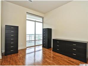 435 South Tryon Street, Unit 704 Charlotte, NC 28202 - Photo 13 of 13 wooden floor and window in a room