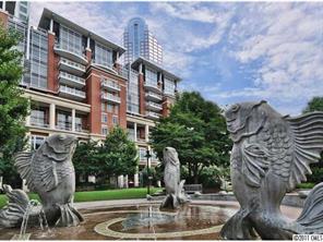 435 South Tryon Street, Unit 704 Charlotte, NC 28202 - Photo 2 of 13 a view of building with yard