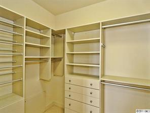 435 South Tryon Street, Unit 704 Charlotte, NC 28202 - Photo 10 of 13 a view of walk in closet with empty racks
