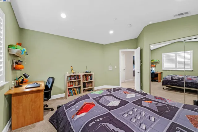 a backyard of a house with yard and outdoor seating