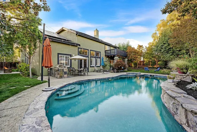 a view of a swimming pool with a patio