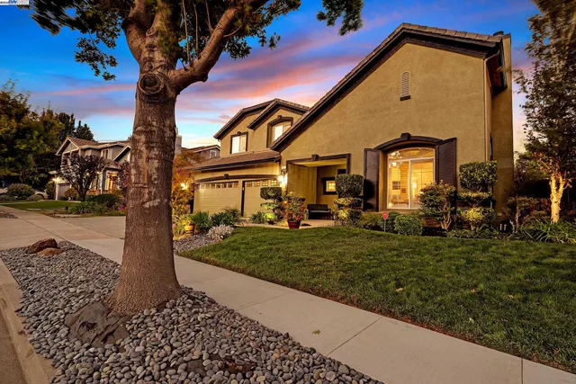 a view of a chairs and table in backyard