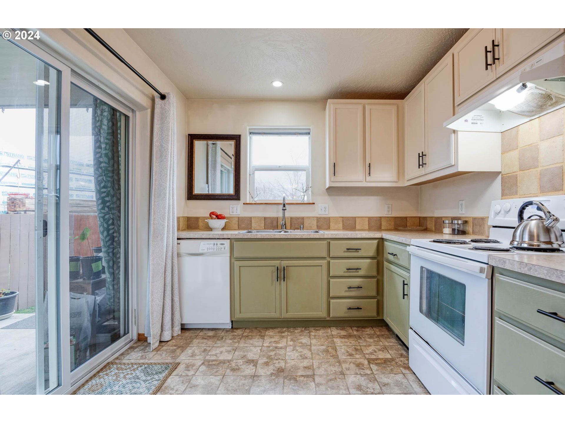4850 A Street Springfield, OR 97478 - Photo 15 of 40 a kitchen with granite countertop a sink stainless steel appliances and cabinets