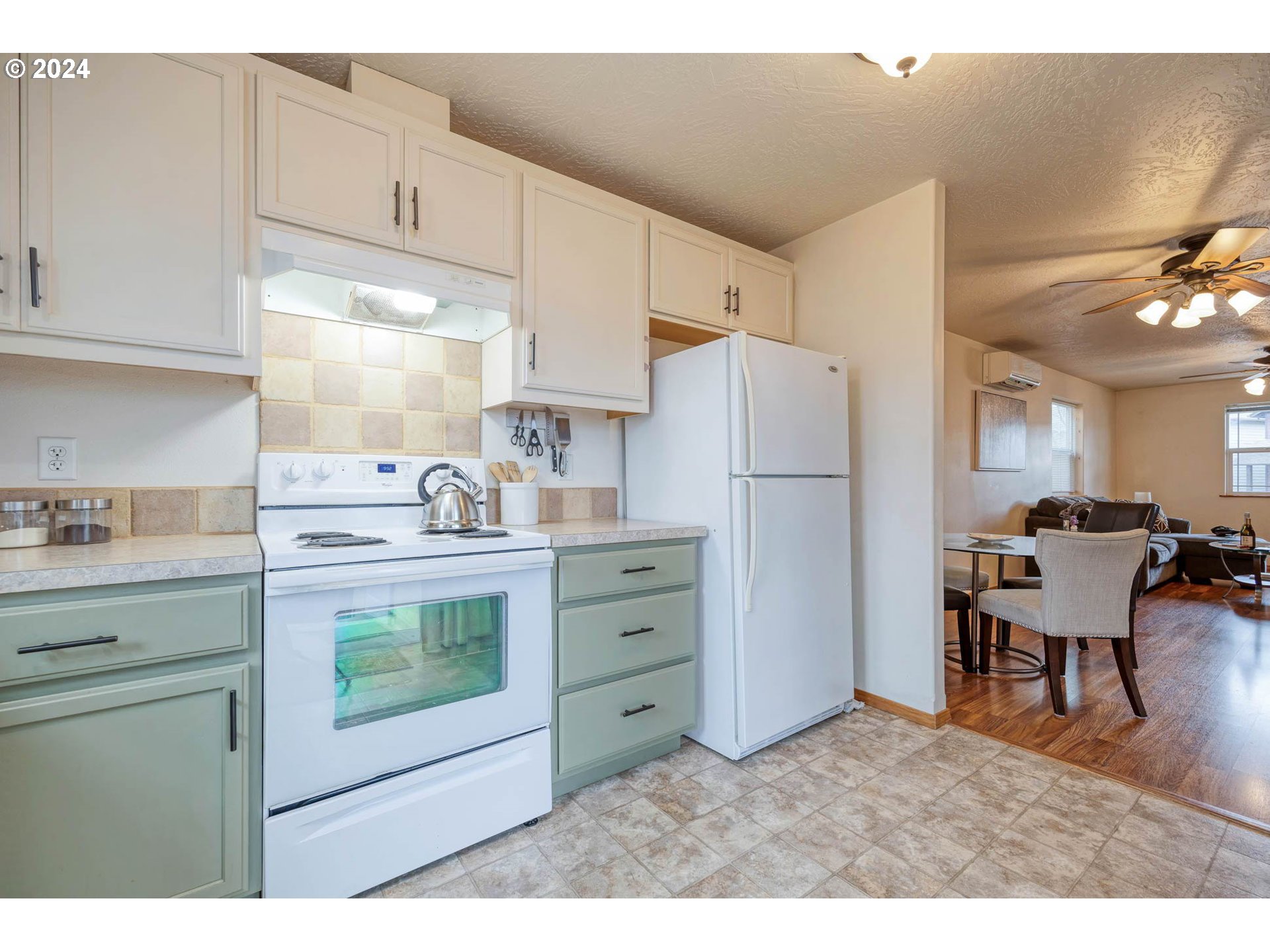 4850 A Street Springfield, OR 97478 - Photo 19 of 40 a kitchen with appliances cabinets and chairs
