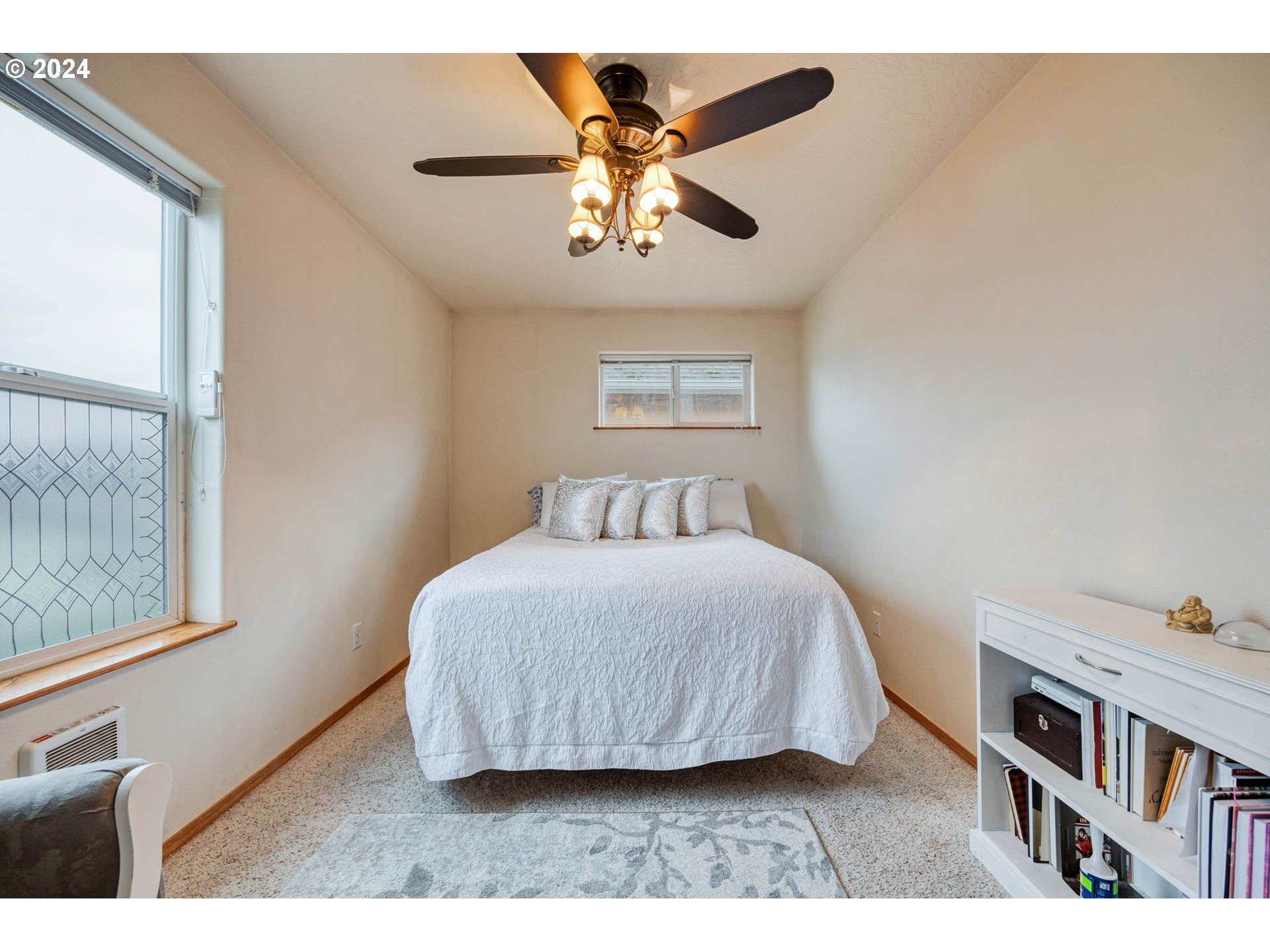 4850 A Street Springfield, OR 97478 - Photo 23 of 40 a bedroom with a bed and a chandelier